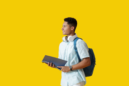 Male African-American student on color backgroundの写真素材