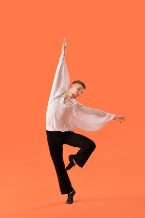 Young ballet dancer on color backgroundの写真素材