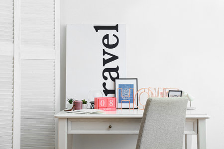 Cube calendar with date MARCH 8 and frames on table in roomの写真素材