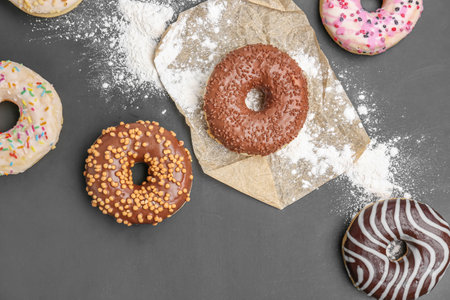 Delicious donuts and sugar powder on dark backgroundの写真素材