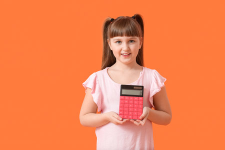 Little girl with calculator on color backgroundの写真素材