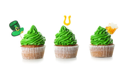 Tasty cupcakes for St. Patrick's Day on white backgroundの写真素材