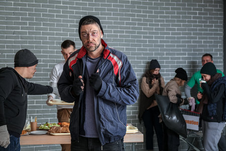 Poor homeless man in warming center