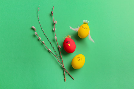 Creative Easter eggs with pussy willow on color backgroundの写真素材