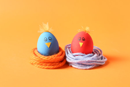 Creative Easter eggs on color backgroundの写真素材