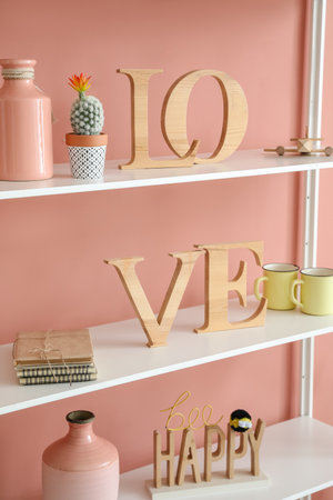 Modern book shelf with decor near color wall, closeupの写真素材