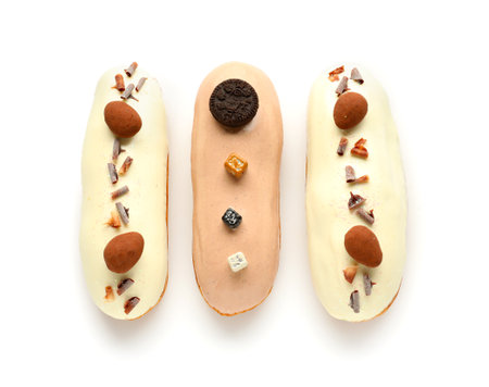 Various glazed eclairs isolated on white background