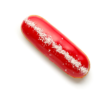 Delicious glazed eclair with coconut shavings isolated on white background
