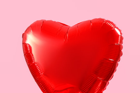 Heart-shaped balloon for Valentine's Day on pink background, closeupの写真素材