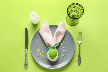 Beautiful Easter table setting on color background