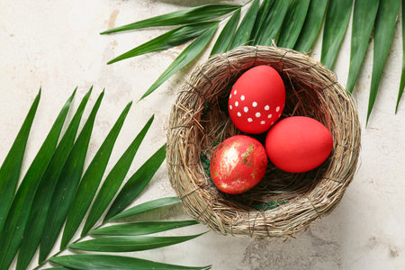 Composition with beautiful Easter eggs on light backgroundの写真素材
