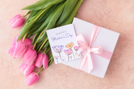 Beautiful flowers, gift and greeting card for Mother's Day on color background