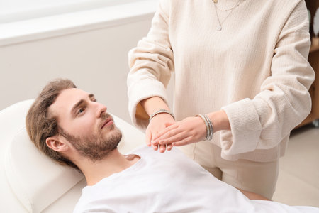 Reiki master working with patientの写真素材