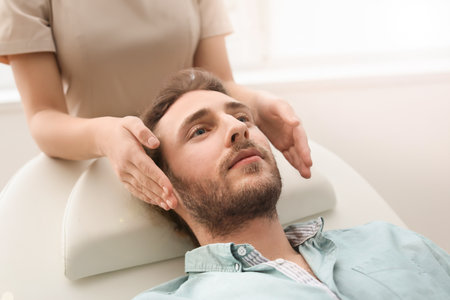 Reiki master working with patientの写真素材