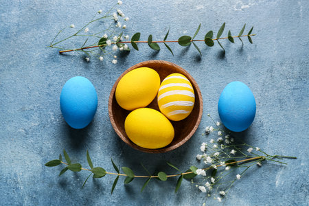 Composition with beautiful Easter eggs on color background