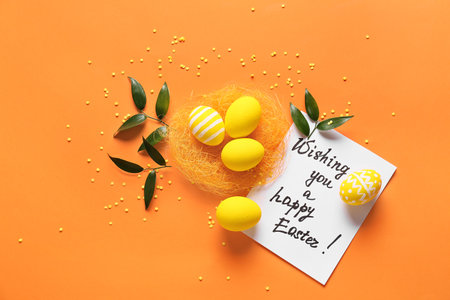 Composition with beautiful Easter eggs on color backgroundの写真素材