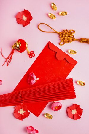 Red envelope and Chinese symbols on pink backgroundの写真素材