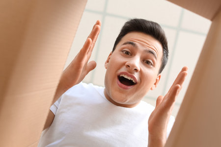 Happy man with open box