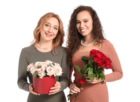 Beautiful women with flowers on white background. International Women's Day celebrationの写真素材