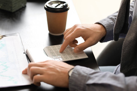 Male accountant working in office, closeupの写真素材