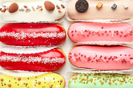 Various glazed eclairs as backgroundの写真素材