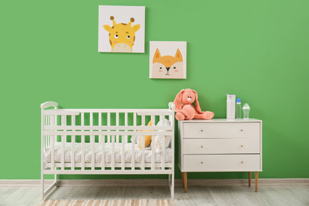 Stylish interior of children's room with baby bedの写真素材