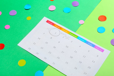 Calendar with marked date of April Fool's Day on color backgroundの写真素材