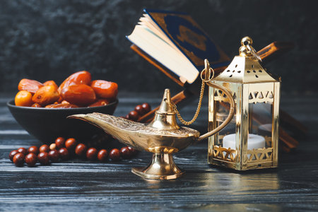 Aladdin lamp of wishes and Muslim lamp on dark wooden backgroundの写真素材