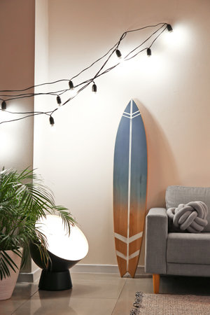 Interior of stylish modern room with surfboardの写真素材