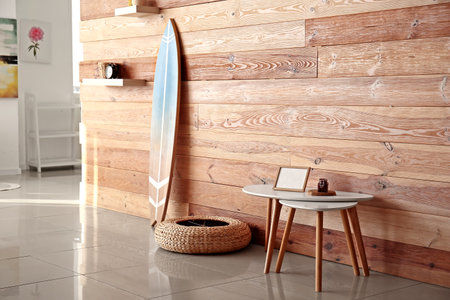 Interior of stylish modern room with surfboardの写真素材