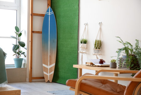 Interior of stylish room with surfboardの写真素材