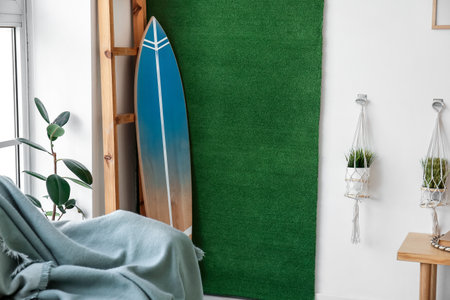 Interior of stylish room with surfboardの写真素材