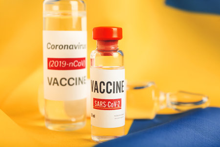 Vaccine for immunization against COVID-19 on flag of Swedenの写真素材