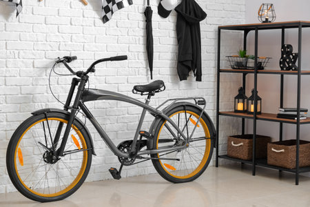 Stylish interior of room with modern bicycle and light brick wallの写真素材