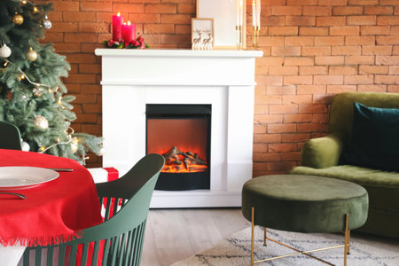 Interior of dining room with Christmas tree and fireplaceの写真素材