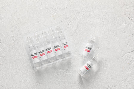 Vaccine for immunization against COVID-19 on light background