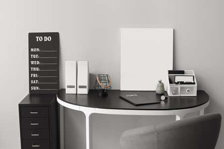 Modern workplace with organizer near light wallのeditorial素材