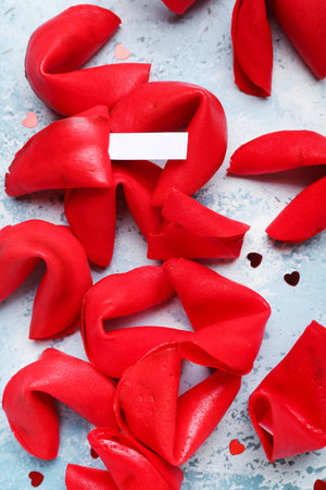 Red fortune cookies with hearts on grunge background, closeup. Valentine's Day celebrationの写真素材
