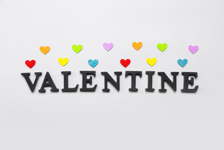 Word VALENTINE with hearts on gray background. LGBT conceptの写真素材