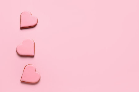 Sweet heart shaped cookies on pink background. valentine's day celebrationの写真素材