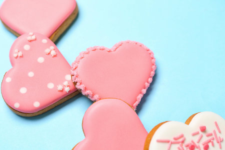 Composition with sweet heart shaped cookies on color background, closeup. Valentine's Day...