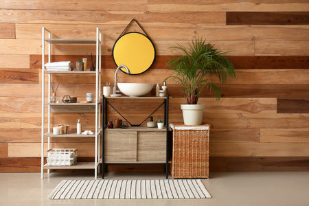 Interior of bathroom with sink, mirror and shelving unitの写真素材