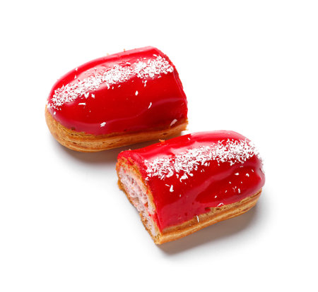 Halves of delicious eclairs isolated on white backgroundの写真素材