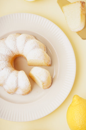 Plate with delicious cake on yellow backgroundの写真素材