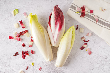 Bunches of fresh endive on light backgroundの写真素材