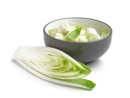 Bowl of cut endive on white backgroundの写真素材