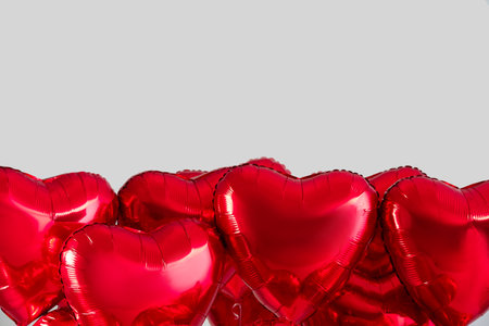Heart shaped balloons for Valentine's Day on light backgroundの写真素材
