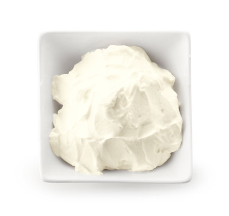 Bowl of tasty cream cheese isolated on white backgroundの写真素材