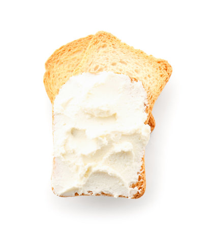 Toasts with tasty cream cheese on white backgroundの写真素材
