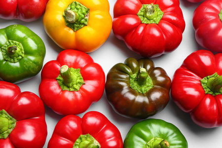 Many fresh bell peppers on white backgroundの写真素材